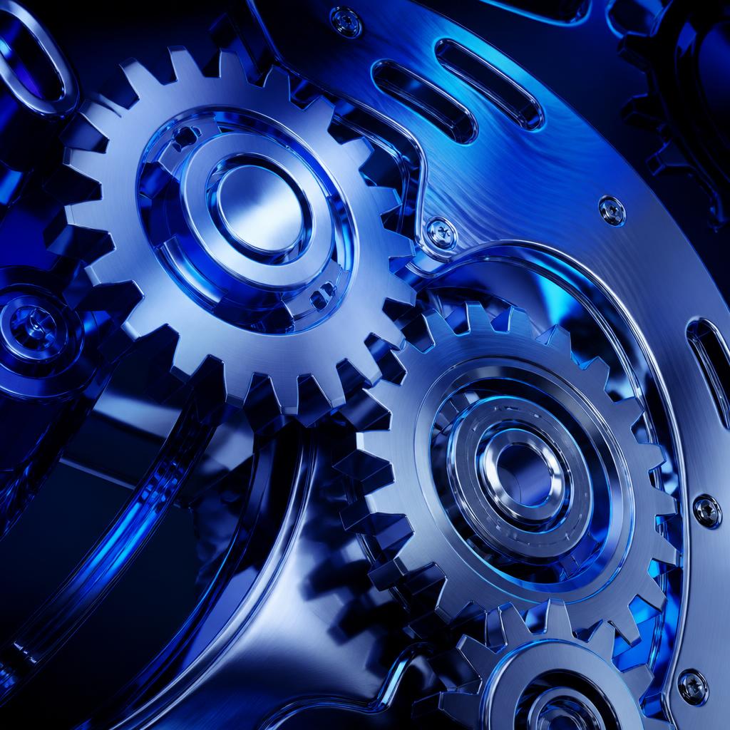 Chrome gears meshing inside a precision machine